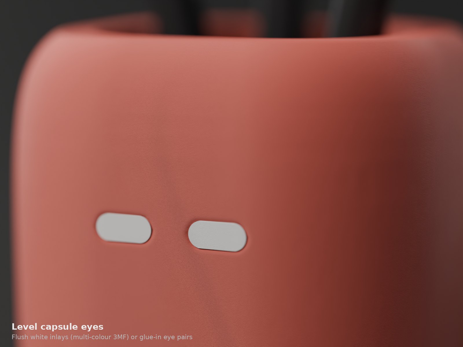 Close-up of the level white capsule eyes on a Squad Pods pen cup